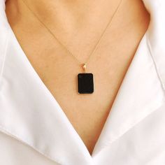 This stunning pendant is set in 14k Solid Yellow Gold with Natural Black Onyx with utmost precision. It is an unique gemstone pendant for nearly every occasion and is completely hassle-free jewelry. 🔷ABOUT GEMSTONE:  Black onyx is often considered a protective stone. It is believed to absorb and transform negative energies, preventing them from affecting the wearer. Black onyx is associated with strength, both physical and emotional. It is believed to provide inner strength, resilience, and sta Black Enamel 14k Gold Necklace, Black 14k Gold Pendant Jewelry, Black Sterling Silver Tarnish Resistant Necklace, 14k Gold Black Tarnish-resistant Necklace, Black 14k Gold Tarnish Resistant Necklace, Black 14k Gold Tarnish-resistant Necklace, Black Pendant Jewelry For Anniversary, Elegant Black Jewelry With Rectangular Pendant, Black Enamel Necklace For Anniversary