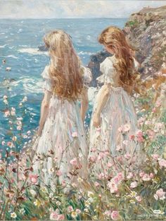 two girls in white dresses standing on the edge of a cliff looking at the ocean