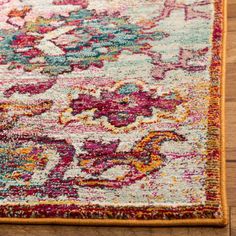 an area rug with colorful flowers on it