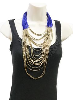 "beautiful long boho Beaded necklace, perfect for the upcoming holiday parties, beach parties etc. ** Long and Layering Necklace ** hand beaded jewelry ** Length of Necklace is 38 inches ** Perfect on a Little Black Dress or even a T-shirt. ** Make a statement with this stunning piece at the party! This beautiful necklace would make a great Gift for someone special. All Items come carefully wrapped in our branded boxes or bags. A complimentary message can be included on request. PRESS: \" TANEES Bohemian Black Beaded Necklaces For Summer, Bohemian Beaded Layered Necklace For Party, Bohemian Long Bib Necklaces For Party, Bohemian Long Bib Necklace For Parties, Blue Bohemian Necklaces For Party, Bohemian Black Beads Necklace For Summer, Bohemian Summer Necklace With Black Beads, Bohemian Long Necklace With Large Beads For Beach, Multi-strand Colorful Beads Necklace For Festivals