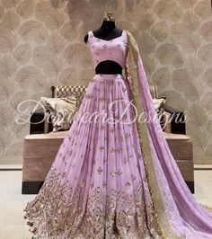 Made to Order/Measurement/Custom Order Lehenga - Color : Lavender - Fabric : Embroidered Georgette with gota work - Fully flared paneled lehenga - Embroidered  Blouse -  Net Dupatta with Gold Border - Drawstring closure with Tassels - - It can be customize in any design or size  PLEASE NOTE: BUYERS ARE RESPONSIBLE FOR ANY CUSTOMS AND IMPORT TAXES THAT MAY APPLY. This is a made to order product. If you opt for 'Made To Measurement Option', we will provide a measurement template and you can share Designer Lavender Sharara With Sheer Dupatta, Lavender Sharara With Sheer Dupatta For Designer Wear, Elegant Lavender Sharara With Zari Work, Lavender Sharara With Resham Embroidery For Diwali, Elegant Lavender Sharara For Wedding, Designer Lavender Sets With Mirror Work, Designer Lavender Sharara With Zari Work, Designer Lavender Sharara For Diwali, Lavender Designer Sharara For Diwali