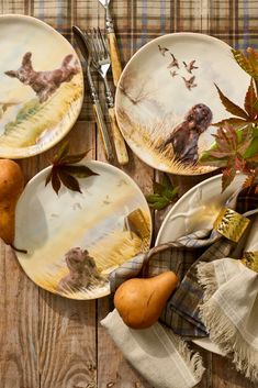 three plates with dogs on them and autumn decorations