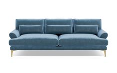 a blue couch sitting on top of a white floor