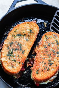 two pieces of bread cooking in a skillet