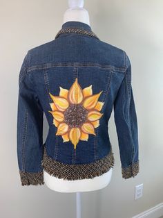 "Denim jacket with hand painted Sunflower  Upcycled  Size 6 Coldwater Creek Chest measurement 18\" across Length 21\" Sleeve length 23 1/2\" 99% cotton 1% spandex" Spring Hand Painted Denim Outerwear, Spring Hand Painted Denim Jacket, Spring Denim Outerwear Hand Painted, Fitted Casual Denim Jacket With Floral Print, Casual Fitted Denim Jacket With Floral Print, Hand Painted Long Sleeve Denim Jacket For Fall, Hand Painted Fitted Cotton Outerwear, Fitted Denim Jacket With Floral Print, Hand Painted Fitted Cotton Denim Jacket