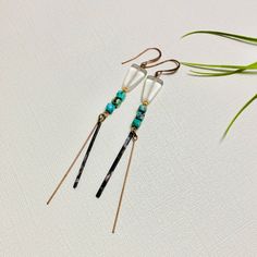 These genuine turquoise gemstone and brass patina earrings make a great gift for that special woman in your life, as a self-care gift, or an elegant and meaningful birthday present. Attract the energy of inner peace and positivity with these modern artistic southwest style turquoise, copper, glass and brass patina dangle earrings. Handmade by Native American artist/designer Loren Lavine in her California studio, these earrings are infused with healing energies. 🪶 MATERIALS/DIMENSIONS >  Earring measures approximately 2.5" long x  1" across >  Copper French earring wire 🪶 STONE/ELEMENT ENERGY >  COPPER enhances energy flow, optimizing clear thought and heightened self-esteem. >  TURQUOISE balances and aligns the chakras, stabilizes your mood and instills inner peace. >  NUMEROLOGY POWER O Bohemian Brass Linear Earrings For Gift, Bohemian Dangle Linear Earrings, Bohemian Brass Linear Earrings For Pierced Ears, Bohemian Linear Earrings, Bohemian Nickel-free Linear Earrings As Gift, Bohemian Style Nickel Free Linear Earrings As Gift, Patina Earrings, Brass Patina, Turquoise Earrings Dangle