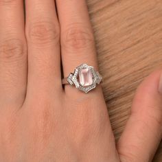 It is a natural pink quartz ring. The main stone is 6 mm*8 mm emerald cut.weight about 1.43 carats The basic metal is sterling silver and plated with rhodium. To change the metal to a solid gold (white/rose) or platinum is also available, please ask for a quotation if you want. You can also go to my shop Home for more elegant rings: https://www.etsy.com/shop/godjewelry?ref=hdr_shop_menu More pink quartz rings: https://www.etsy.com/shop/godjewelry?section_id=22545141 Customization is always welco Rainbow Topaz Ring, June Birthstone Ring, Spinel Ring, Sterling Silver Wedding Rings, Etsy Wedding Rings, Silver Wedding Rings, Pink Gemstones, Elegant Ring, Affordable Jewelry