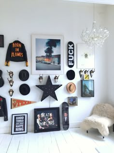 a white room filled with lots of framed pictures