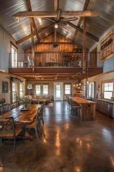 A blend of industrial metal beams and rustic wood creates a unique aesthetic in this spacious barndominium. Raw and warm. Follow to see more mixed-style interiors. Barndominium Ideas Western, Shop To Home Conversion, Western Barndominium, Small Shop House, Small Pole Barn Homes Simple, Industrial Barndominium, Barnhouse Homes, Farmhouse Barndominium Interior, Metal Barn Homes Barndominium