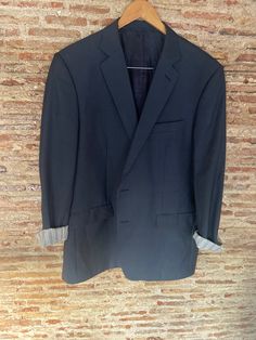 Burberry minimalist maxi blazer. It is a model originally from the men's collection but can be made unisex by wearing it oversized. It has structured shoulders. The interior lining is striped and interior pockets with vintage check lining. It has two exterior pockets with flaps to store your hands. The size is equivalent to an international L Width from armpit to armpit 56 cm Shoulder width 49 cm Length from neck to hip 84 cm Sleeve length 66 cm Maxi Blazer, Womens Blazers, Oversized Blazer, Men's Collection, Blazer Suit, Burberry, Spain, Bathing Beauties, Sleeve Length