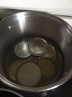 the pan is full of coins on the stove