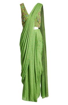 This saree has a hand-embroidered cropped top with intricate beadwork and lustrous sequins and is paired with a skirt featuring attached wraparound draping. This outfit is prestitched, so you can put it together in 30 seconds or less. 7 1/2" length (top) 52 1/2" length (bottom) (size Medium) V-neck Top has hook-and-eye closure; skirt has hidden side-zip closure Top and skirt feature hook-and-eye attachments for easy drape adjustments Lined 100% viscose Spot clean Made in India Asian & Pacific Is Drape Saree, Top And Skirt, 30 Seconds, Cropped Top, V Neck Tops, A Skirt, Bead Work, Hand Embroidered, Side Zip