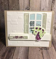 a handmade card with a vase of flowers on the window sill that says a little note