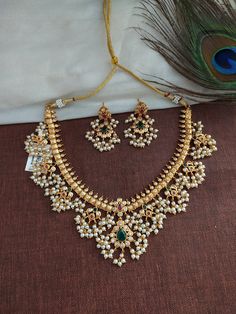 Traditional guttapusalu short/choker necklace with Jhumka earrings. Matte gold finish. Polish and stones are guaranteed. All pearls are hand settled very carefully. Necklace length - 7 inches (Golden tread will be at back to adjust the height) Earring height - 2 inches Width - 1 inch All the raw material used in this product is of high quality and is handcrafted with love. Premium Quality and High craftsmanship 100% Satisfaction Guarantee: Long-Lasting Plating, High-Quality Stones. Gifting: This South Indian Choker Necklace Gold, Jewelry Indian Wedding, Gutta Pusalu, Indian Choker Necklace, Spike Necklace, South Indian Jewelry, Gold Long Necklace