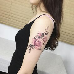 a woman's arm with flowers on it and the words instagram written below