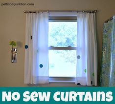 there is a window in the bathroom with no sew curtains