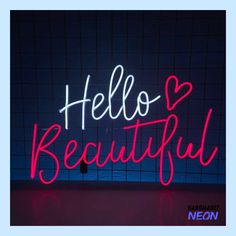 a neon sign with the words hello beautiful written in red and white on a blue tiled wall