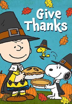 a charlie brown thanksgiving card with the words give thanks and a dog holding a pie