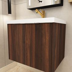 a bathroom with a sink, mirror and wooden cabinet in the corner on the wall