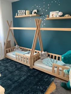 a child's bedroom with bunk beds and stars on the wall