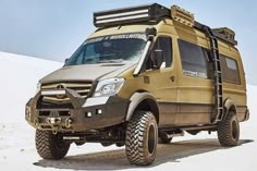 an off - road vehicle is parked in the desert