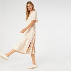 Say hello to the Margaux Tiered Ruffle Sleeve Dress, the epitome of effortless style! With its relaxed fit, this dress ensures you feel comfortable and confident all day long. The longer ruffle sleeves add a chic twist, while the decorative buttons give it a hint of sophistication. Plus, it's equipped with pockets to keep your essentials close at hand. Perfect for both casual outings and special events, this dress is a must-have in your wardrobe! Materials: Viscose. Flowy Midi Dress With Ruffle Hem And Sleeve, Casual Midi Dress With Flutter Sleeve And Ruffle Hem, Spring Ruffle Sleeve Maxi Dress For Day Out, Spring Maxi Dress With Ruffle Sleeves For Day Out, Spring Dresses With Ruffles In Relaxed Fit, Daywear Midi Dress With Ruffle Hem And Sleeves, Chic Flowy Midi Dress With Ruffle Sleeves, Midi Dress With Ruffle Hem And Ruffle Sleeves, Summer Maxi Dress With Ruffle Sleeves