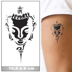 an image of a tattoo on the side of a woman's leg with a buddha head