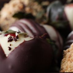 chocolate covered strawberries with white frosting and sprinkles