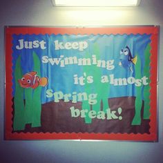 a bulletin board that says, just keep swimming it's almost spring and break