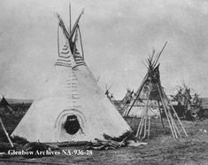 an old black and white photo of native american teepees