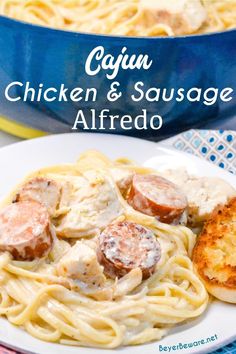 chicken and sausage alfredo on a plate with bread