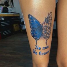 a woman's leg with a butterfly tattoo on it and the words no rain, no flowers written in blue ink