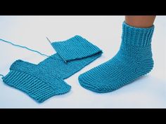 a pair of blue knitted socks and mittens