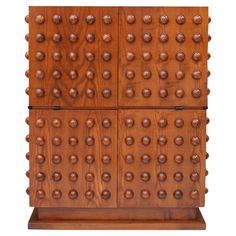 a wooden cabinet with many balls on it