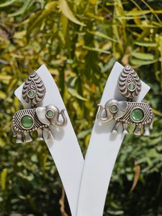 These are german silver earrings and are authentic INDIAN TRIBAL DESIGN. Elephants in Indian culture define tranquility and prosperity that is why they are worn by Indian tribal women. The eye of the earring is made by jade stone. There is intricate carving done on the earrings to enhance its features. Intricate Carving, Silver Elephant, Elephant Earrings, Silver Elephants, Authentic Indian, Indian Culture, German Silver, Jade Stone, The Eye