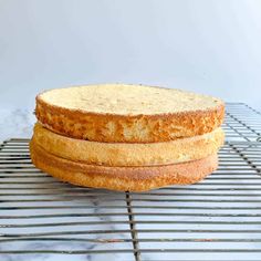 two cakes sitting on top of a cooling rack