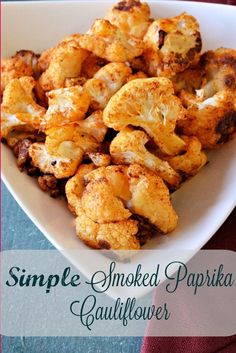 roasted cauliflower in a white bowl with the words simple smoked papika cauliflower