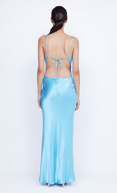 The elevated BEC + BRIDGE Margaux Keyhole Maxi Dress is crafted from a lustrous, topaz blue fabric in a flattering silhouette. The bias cut maxi dress features a v neckline, statement double keyhole cut-out detail and binding that travels and ties at the low cut, open back. Blue V-neck Maxi Dress With Side Slits, Gala Slip Dress With Tie Back In Maxi Length, Maxi Slip Dress With Tie Back For Gala, Blue Satin V-neck Dress For Party, Blue Evening Dress With Side Slits For Prom, Blue Maxi Dress With Side Slits For Prom, Maxi Slip Dress With Back Opening For Night Out, Blue V-neck Maxi Dress For Prom, Blue Maxi Length Backless Dress For Night Out