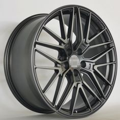 a close up of a wheel on a white background with a black rim and spokes