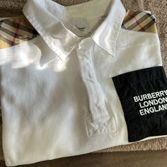 Still In New Condition Burberry Polo White Collared Preppy Shirt, White Preppy Collared Shirt, Preppy White Cotton Shirt, White Preppy Cotton Shirt, White Cotton Preppy Shirt, Burberry Shirts, Burberry Shirt, Burberry London, Shirt Color