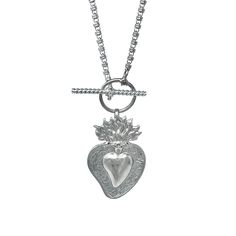 Based on a DelBrenna family design, our Flaming Heart pendant represents our passion for our craft. We love beauty, fashion, and sharing our creativity with you. This pendant calls you to open your heart and share your wonderful self with the world! Pendant in 925 silver with DelBrenna’s Signature Rhodium Finish. It is 2 1/4” in height and 1 1/2” wide. Its bail slides onto all DelBrenna chains up to 5mm. Chain sold separately. Unique Silver Heart Charm Necklace, Unique Silver Heart Necklace With Charm, Sterling Silver Heart Charm Necklace For Jewelry Making, Silver Spiritual Heart Charm Necklace, Heart-shaped Sterling Silver Jewelry With Silver Clasp, Unique Sterling Silver Necklace With Heart Charm, Sterling Silver Heart Charm Jewelry, Sterling Silver Heart Jewelry With Charms, Sterling Silver Heart Pendant Jewelry Gift