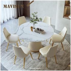 a white marble dining table surrounded by chairs and a vase with a plant in it