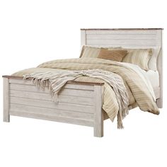 a white bed with a wooden headboard and foot board