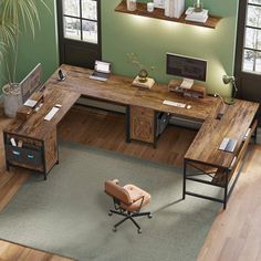 an office with green walls and wood flooring in the center is shown from above