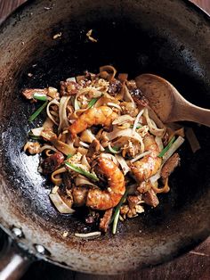 stir fry with chicken and vegetables in a wok