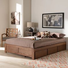 a bed sitting in a bedroom next to a dresser with drawers on it's sides