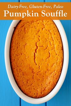 a pumpkin souffle in a white bowl on a blue wooden table with text overlay