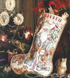 a christmas stocking sitting on top of a table next to other ornaments and decorations