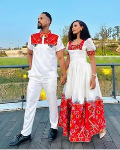 Description Celebrate your love in style with our vibrant Habesha couples outfit, perfect for weddings or special occasions. The striking red design, crafted from high-quality Menen fabric and comfortable cotton material, radiates passion and tradition. This coordinated set embodies the essence of Habesha weddings, seamlessly blending cultural richness with contemporary elegance. Make a bold statement as a couple with this enchanting Habesha outfit, showcasing the timeless beauty of Ethiopian tr Ethiopian Dress, Couples Outfit, Diy Skirt, Traditional Clothes, Red Design, Wedding Poses, Caicos Islands, British Indian, Handmade Home