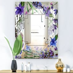 a mirror with purple flowers on it in a room